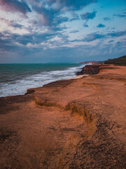 Beach seen from the top of the mountain, blue sky, nature, mountain, cliffs, Tropical climate, summer climate, beach day - Photo in Praia da Pipa - RN, Brazil