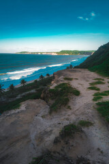 Beach seen from the top of the mountain, blue sky, nature, mountain, cliffs, Tropical climate, summer climate, beach day - Photo in Praia da Pipa - RN, Brazil