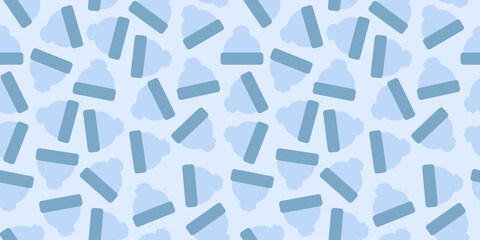 Fototapeta premium winter hats patern background. blue winter hats on a white background. warm hats for winter patern background.
