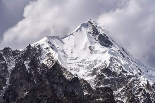 Closeup view of snow-capped top of Rakhiot peak on Nanga Parbat seen from Tarishing, Astore, Gilgit-Baltistan, Pakistan