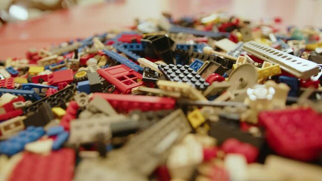Loads of colourful old plastic bricks to build a toy, in France