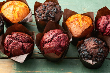 Mix of muffins ( cupcake ) chocolate , vanilla , berries . Top view