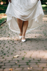 Bride's shoes on the pavement