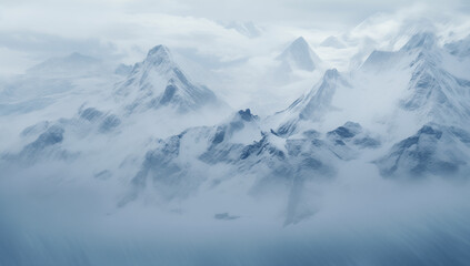 Fototapeta premium Misty snow-covered mountain range in soft blue tones