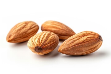 A group of nuts sitting on a white surface, suitable for food or decorative uses