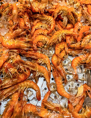 Fresh shrimp on ice at seafood restaurant buffet. High quality photo