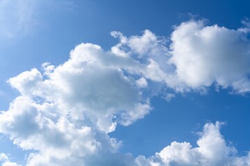 Beautiful blue sky and clouds natural background. Cumulus clouds in the blue sky. White fluffy clouds on blue sky in summer. 