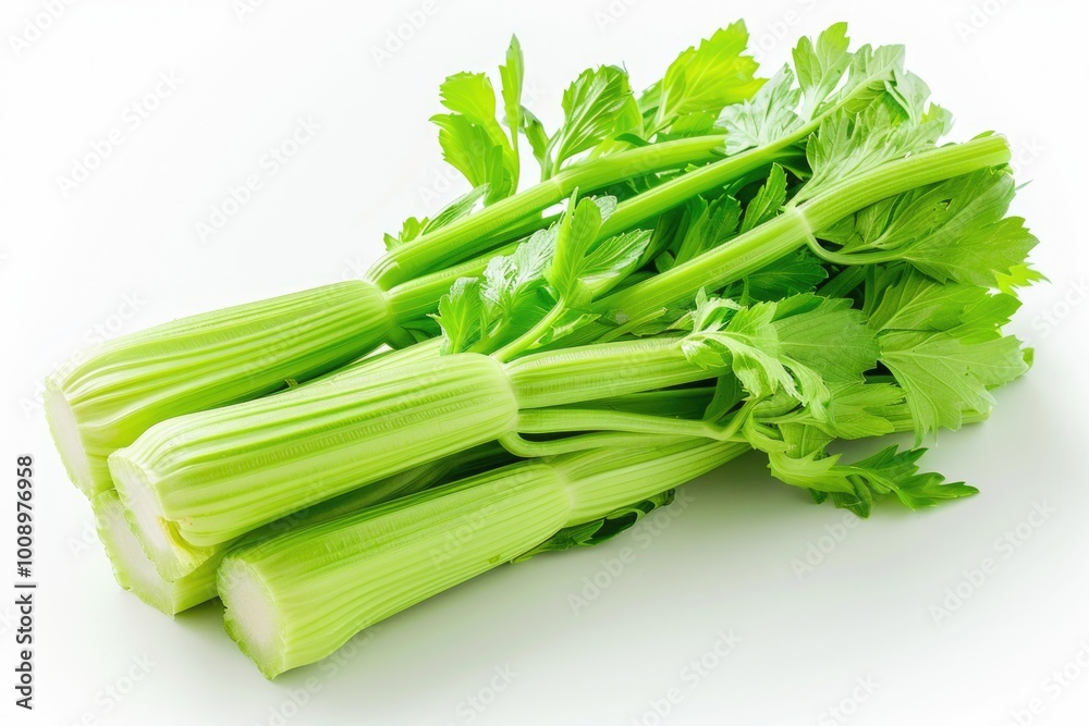 Sticker Fresh celery stalks arranged on a clean white surface, ideal for food photography or culinary concepts