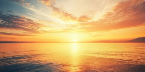 Fototapeta premium A breathtaking sunset over the calm ocean, with vibrant colors reflecting on the water's surface, creating a serene atmosphere.