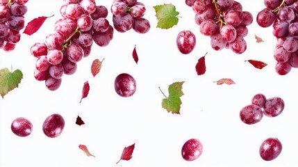 Red grapes with leaves on white surface