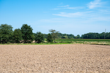 Plowed and fertilized agriculture fields at the Flemish countryside in Kortenaken, Belgium