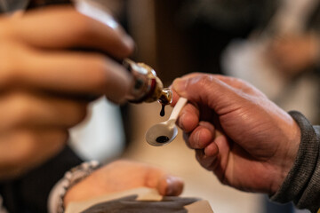 A moment of balsamic vinegar tasting in a vinegar factory