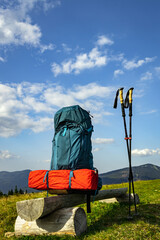 Hiking in the mountains in summer with a backpack and a tent. Beautiful landscape in the mountains.