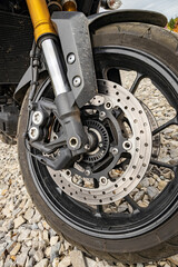 Motorcycle front wheel with spokes and brakes assembled.