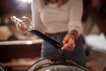 The decanting of balsamic vinegar is traditionally done with a glass instrument that in addition to decanting allows for quality control.