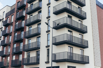 Contemporary apartment building with modern facade with balconies, residential construction