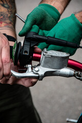 Hand holding the throttle on a motorcycle handlebar