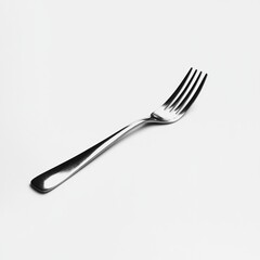 A sleek silver fork placed on a white background, used for eating and serving food.