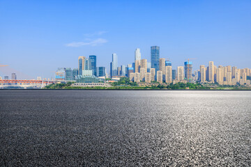 Asphalt road and city skyline with modern buildings scenery in Chongqing. car background.