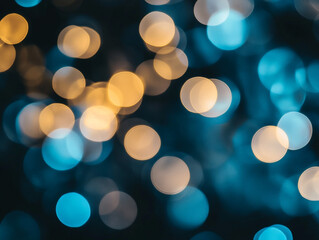 Obraz premium Blurred light blue circles on a dark background. Abstract bokeh lights.