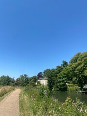 A path along a river in the English countryside 