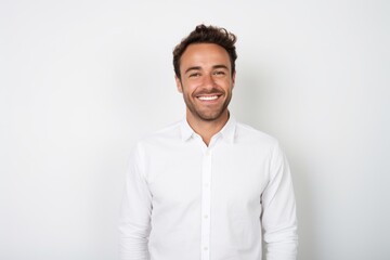 Portrait of a satisfied man in his 30s wearing a classic white shirt in front of white background