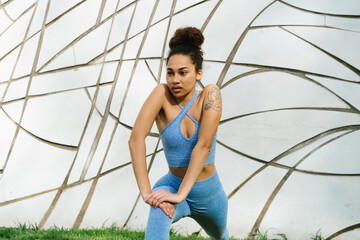 Woman Stretching Before Workout in Blue Activewear