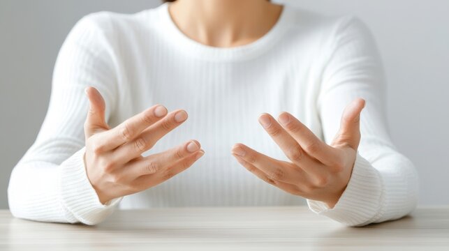 A person gesturing with their hands, conveying a sense of explanation or emotion. This represents communication and interaction.