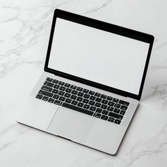 A sleek laptop on a marble surface, showcasing a minimalist design and blank screen.