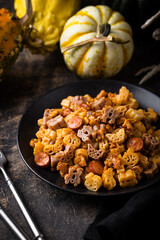 Halloween pasta in shape of spider, bat and pumpkin