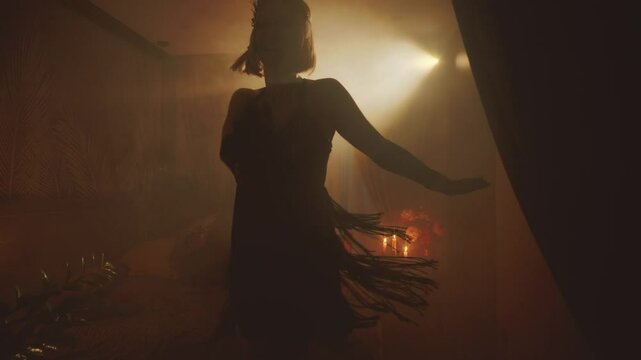 Old film style black dark female silhouette dancing sexy vintage dress fringe waving retro happy woman dancer moving on dance floor night club. room full smoke free spase for text invitation party 4k
