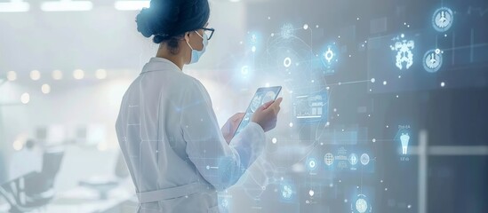A doctor is using digital technology to control medical data and information on the screen