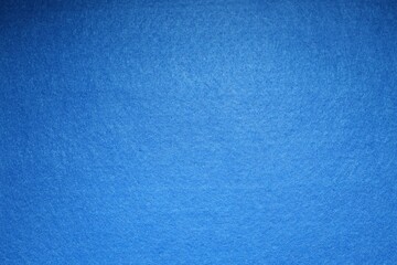 Naklejka premium Blue textured surface as background, top view