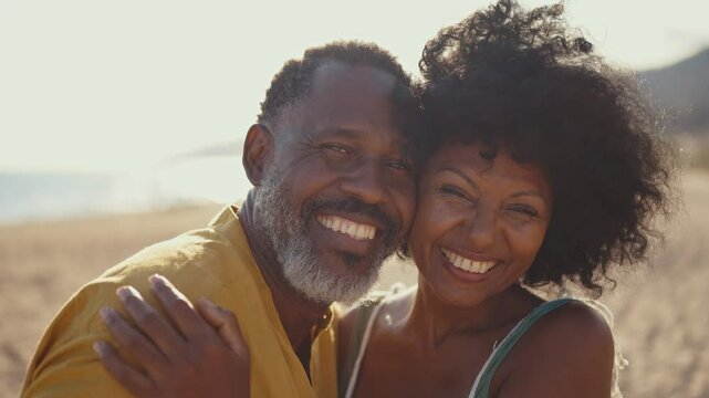 Cinematic video of an happy latin senior couple spending time at the beach. Concept  about seniority and lifestyle