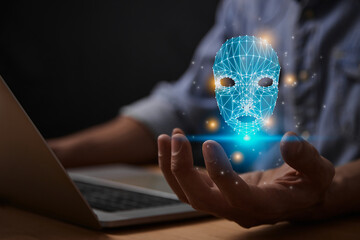 Ai Technology or Artificial Intelligence Robot Face Concept. Ai Artificial Intelligence Robot Face Icon on Businessman's Hand work With Laptop Computer
