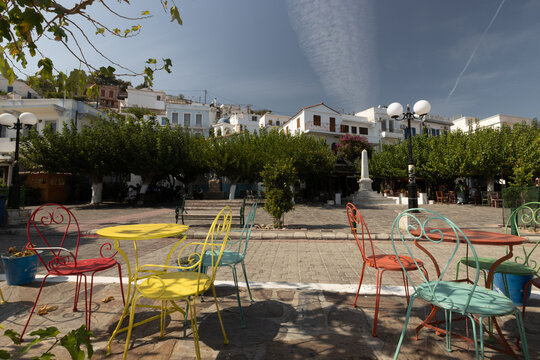 Cafe with colorful chairs at Ikaria's capital main square of Agios Kirykos.
