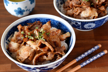 Butadon is a Japanese dish featuring sliced pork simmered in a savory-sweet sauce of soy sauce, sugar, and mirin, served over a bowl of steamed rice. It’s a comforting and flavorful meal.