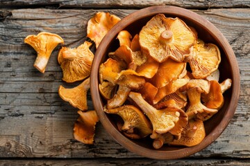 Fresh chanterelle mushrooms on rustic wooden table