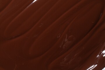 Tasty melted chocolate as background, top view