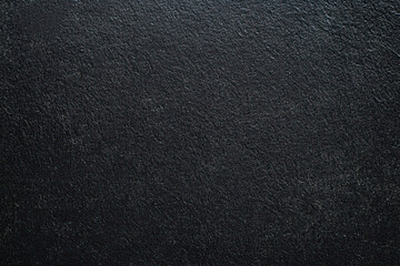 Dark gray background with fine grainy texture, space for text