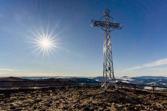 Tarnica Peak in Bieszczady on a Crisp Autumn Morning with Cross and Clear Blue Sky
