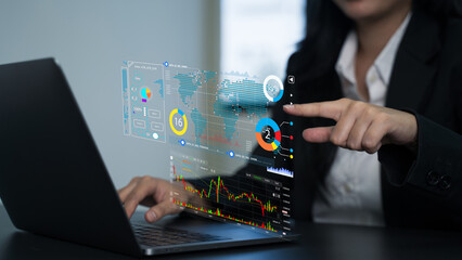Busines using a computer to complete Individual income tax return form ai online for tax payment. Various financial documents, graphs, reports.