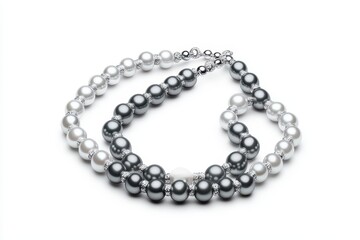 Obraz premium Elegant pearl necklace showcasing a blend of black and white pearls on a white isolated background.