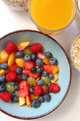 Assortment of various breakfast foods and drinks on the white table. Flat lay.