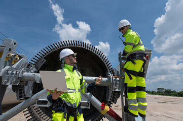 Wind Turbine Maintenance and Repair Technician, Engineer Checking Turbines working maintenance clean power generator system