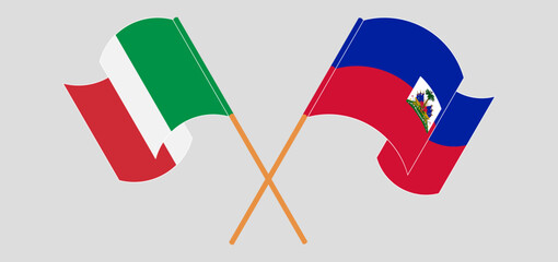 Crossed and waving flags of Italy and Republic of Haiti. Vector illustration