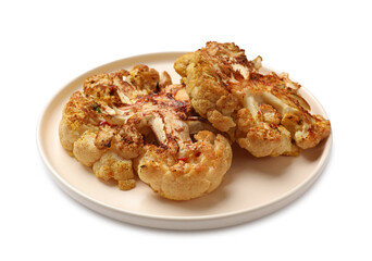 Delicious baked cauliflower steaks isolated on white