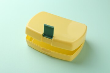 One empty lunch box on light blue background