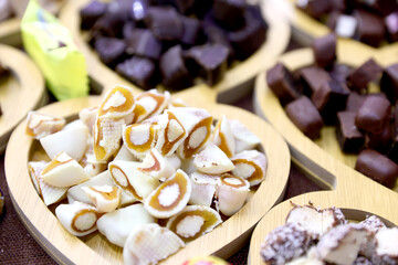 Raw pieces of different assortments of white chocolate candies.