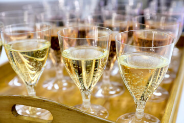 A lot of glasses of champagne in a nice atmosphere at a party.
